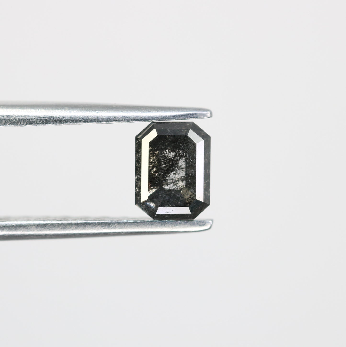 0.63 CT Salt and Pepper Emerald Shape Diamond for a Timeless Engagement Ring: Distinctive Gemstone Jewelry Piece - JayKrishna Diamond