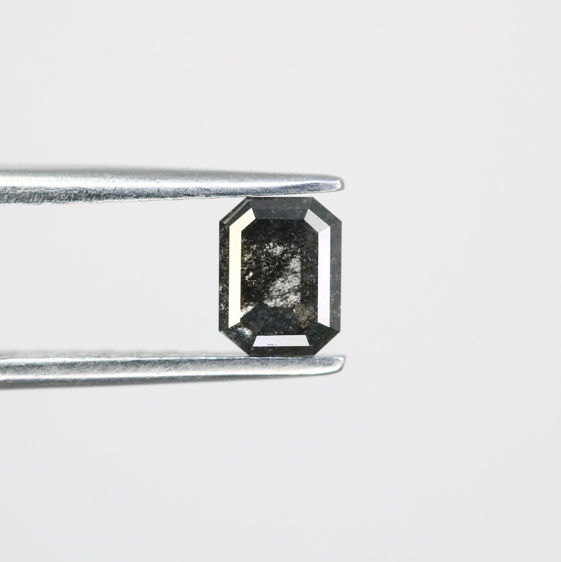 0.63 CT Salt and Pepper Emerald Shape Diamond for a Timeless Engagement Ring: Distinctive Gemstone Jewelry Piece - JayKrishna Diamond