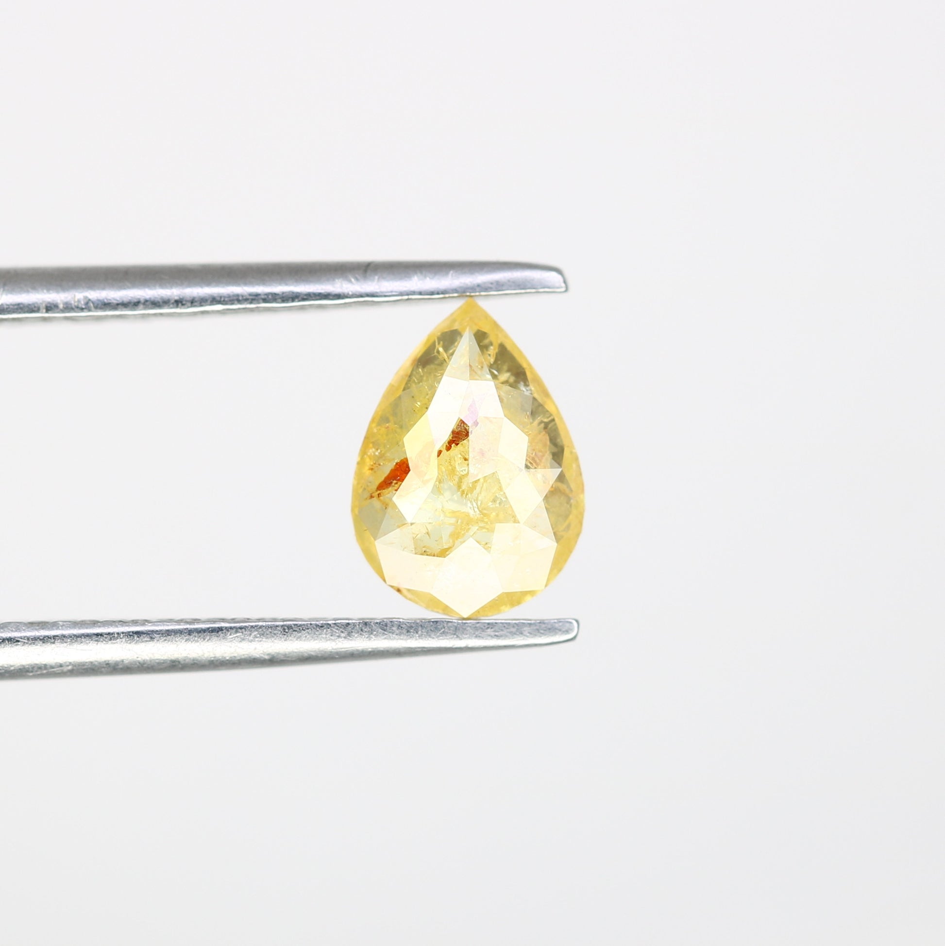 0.62 CT Pear Cut Natural Yellow Diamond (6.90 MM) for a Striking Engagement Ring: Distinctive Gemstone Jewelry Piece - JayKrishna Diamond