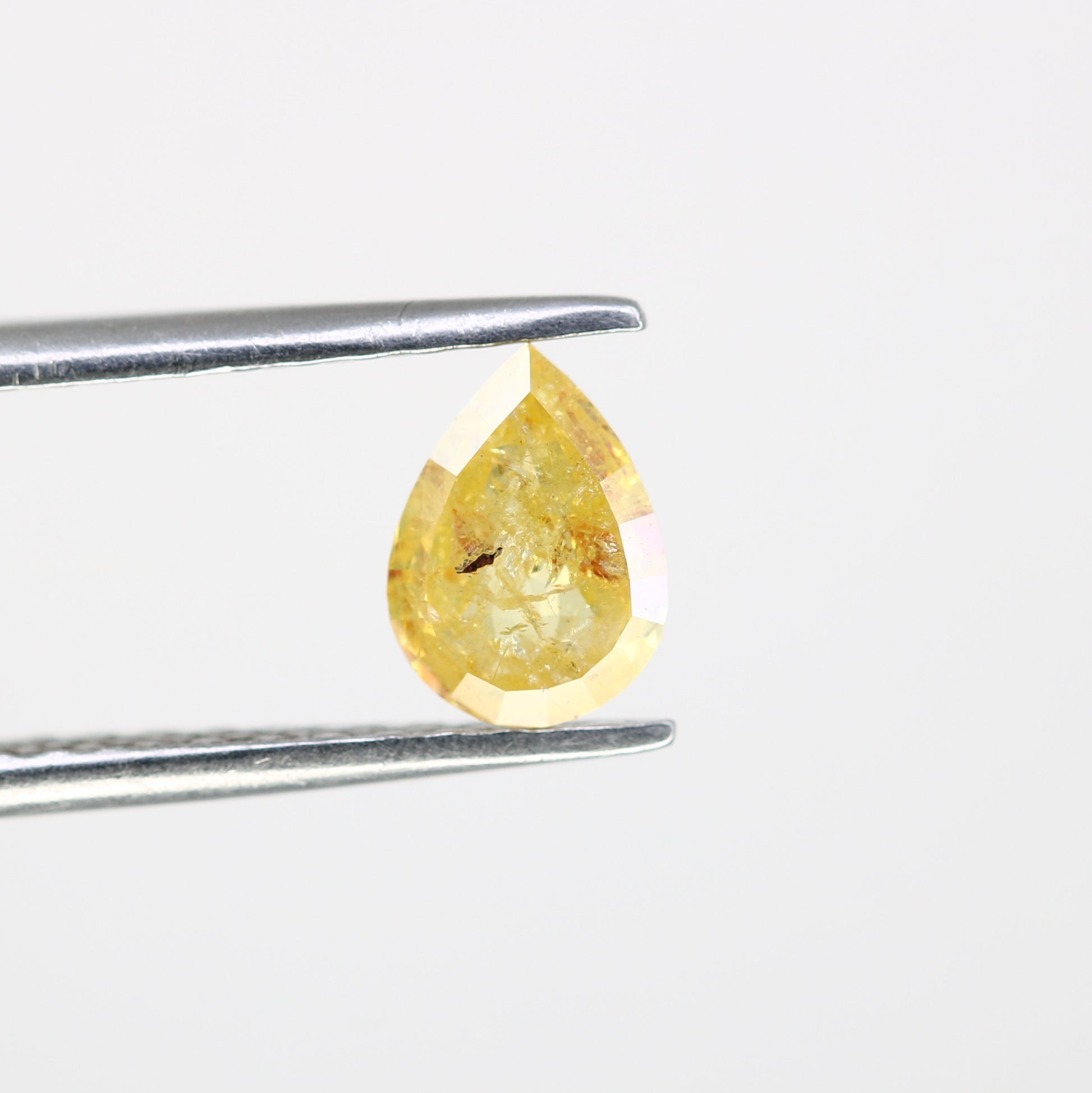 0.62 CT Pear Cut Natural Yellow Diamond (6.90 MM) for a Striking Engagement Ring: Distinctive Gemstone Jewelry Piece - JayKrishna Diamond