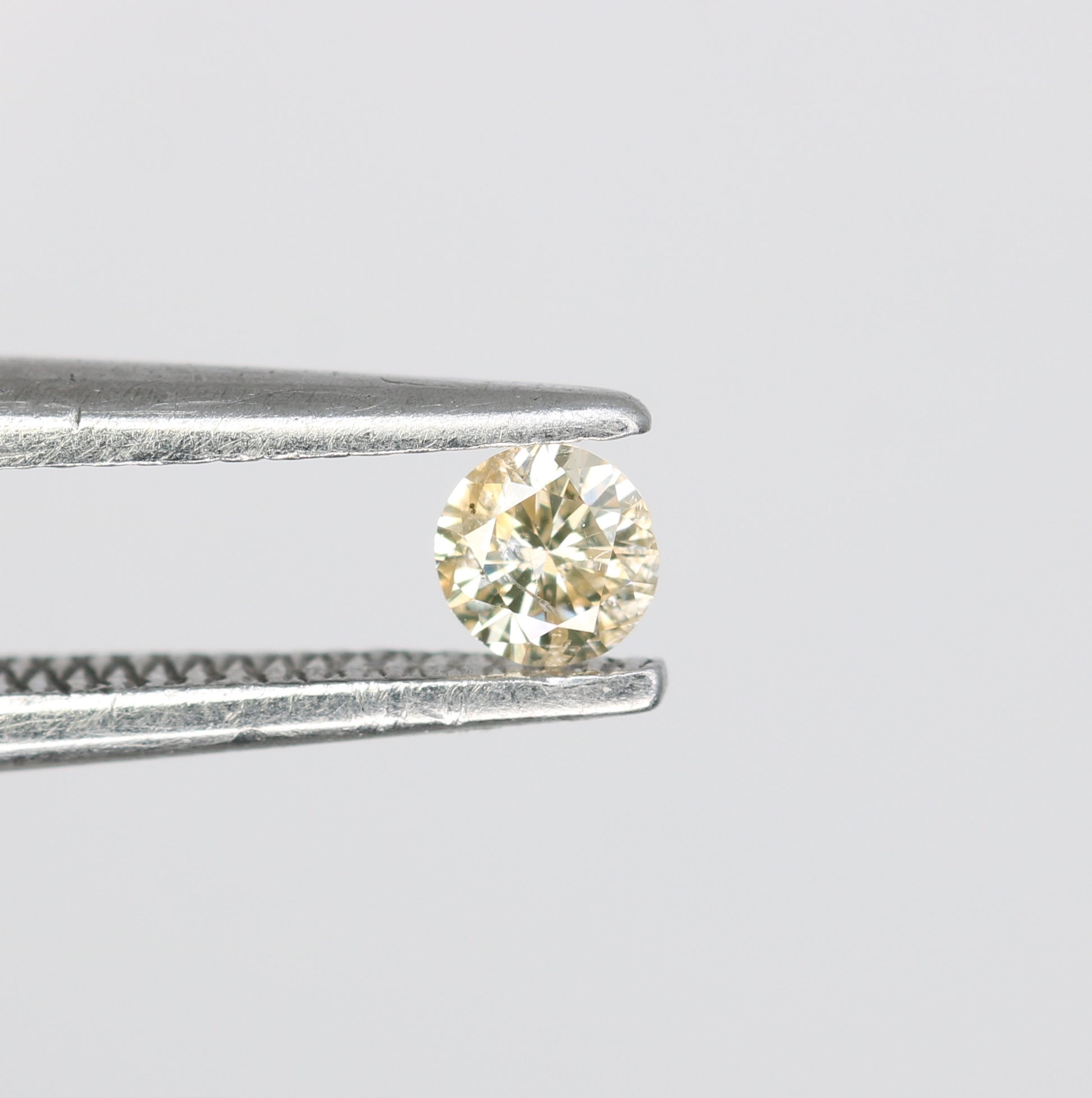 0.09 CT Natural Light Yellow Round Brilliant Cut Salt and Pepper Diamond for Custom Engagement Rings & Unique Jewelry - JayKrishna Diamond